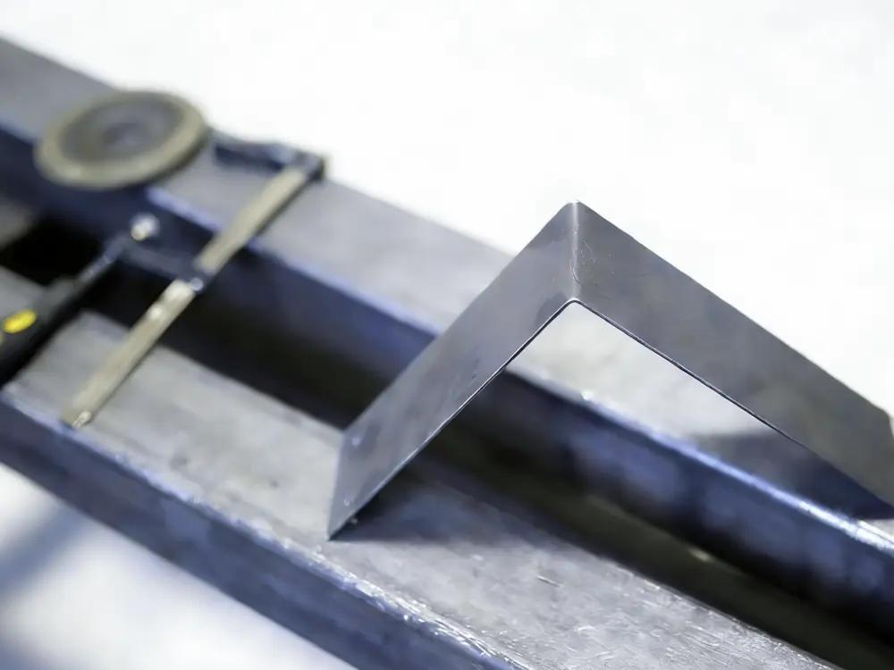 Precision bent metal part on industrial press brake equipment