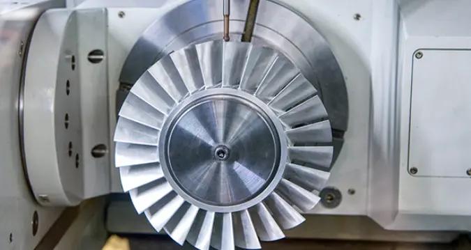 Precision turbine component being machined