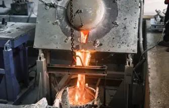 Molten metal being poured during die casting production