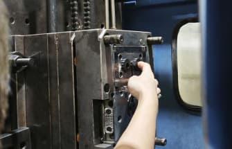 Injection molding machine producing a custom plastic part