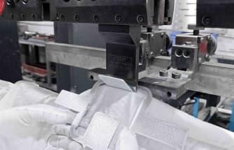 Sheet metal fabrication equipment forming a metal component