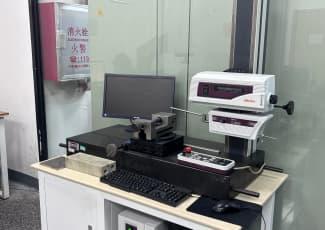 Technician performing surface inspection on aluminum extrusion